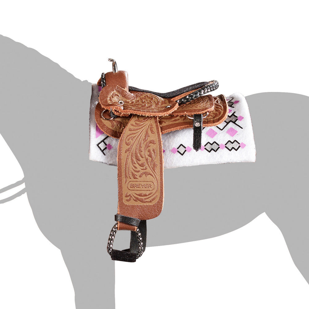 Brown tooled leather Western pleasure saddle with white blanket featuring pink and black geometric patterns, displayed on gray horse silhouette