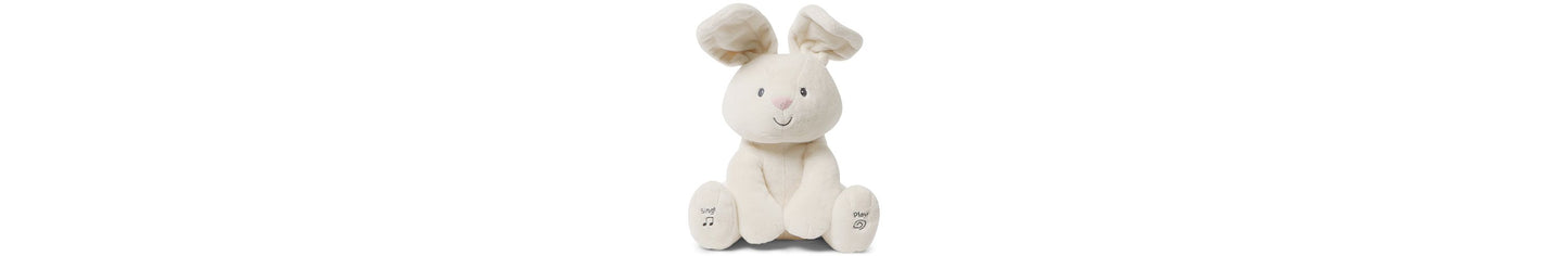 Cream-colored plush bunny with floppy ears, smiling face, and interactive buttons on its paws