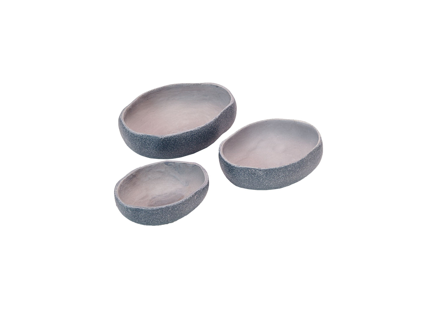 Three nesting bowls with textured gray exterior and smooth pale interior, arranged on plain background