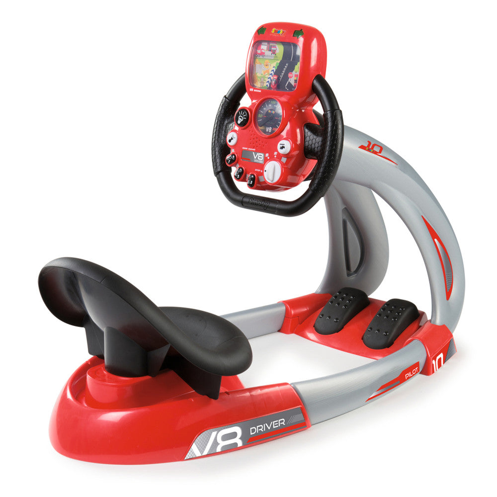 Red and gray V8 Driver racing simulator with black steering wheel controller and foot pedals, featuring digital display screen