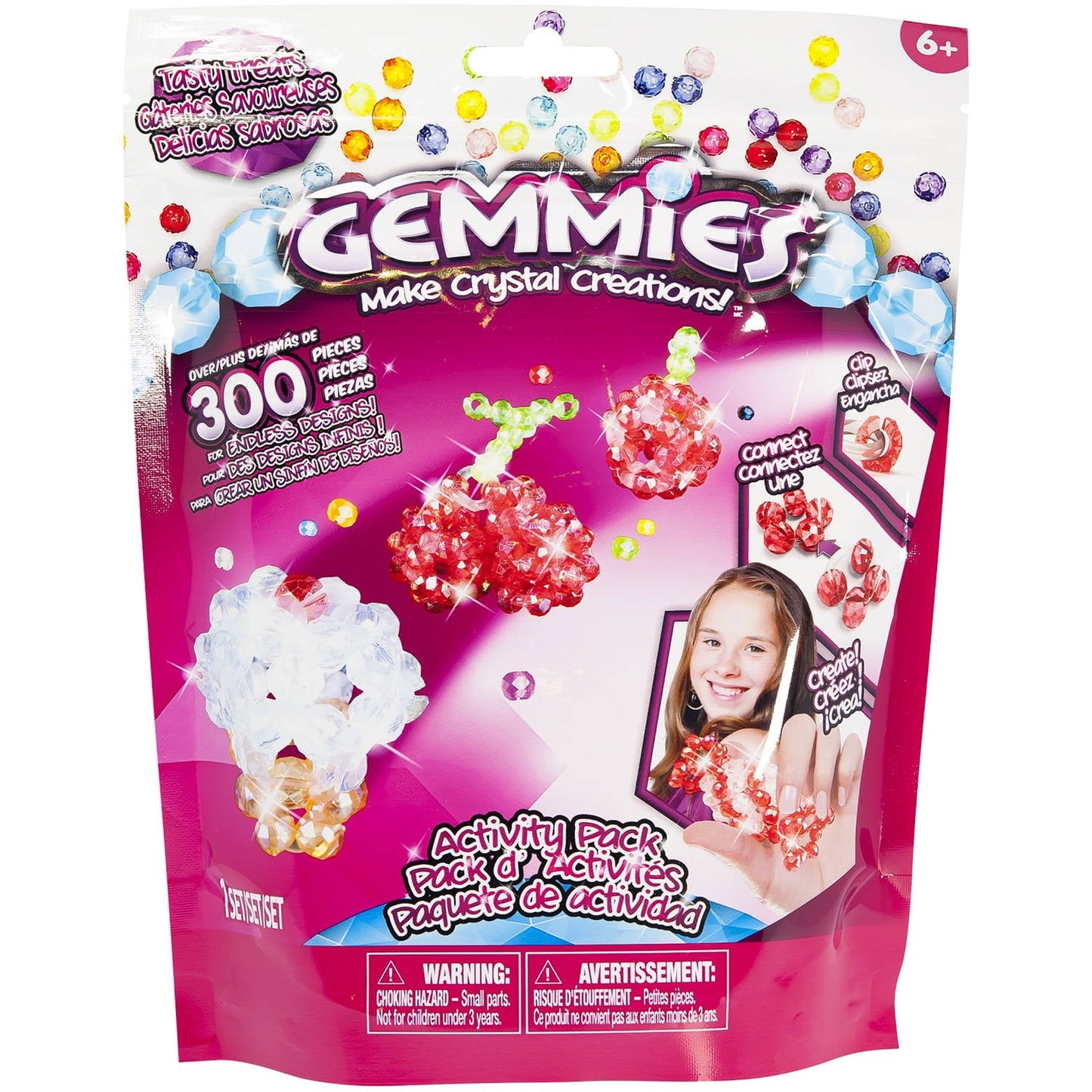 Gemmies Activity Pack Tasty Treats craft kit package showing 300 colorful crystal beads and finished sparkly creations modeled by a child, age 6+