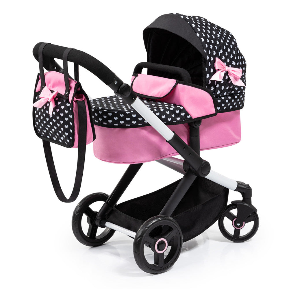 Doll pram with black and white heart pattern canopy, pink seat and basket, black frame with white accents, matching pink handbag attached to handle