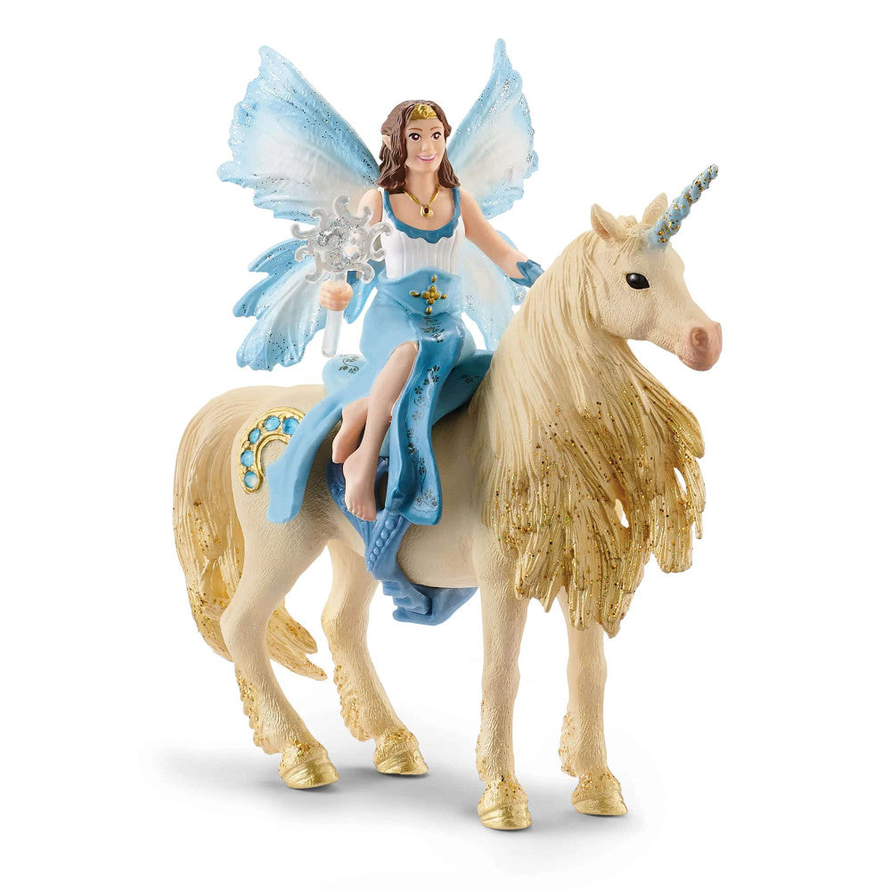 Fairy figurine with blue wings and white dress riding a cream-colored unicorn with gold mane and horn
