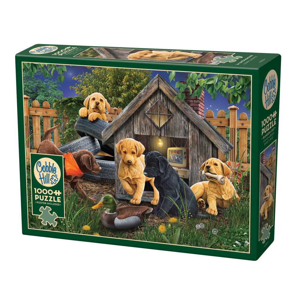 Cobble Hill 1000 piece jigsaw puzzle box featuring three Labrador Retrievers playing outside a wooden doghouse at night
