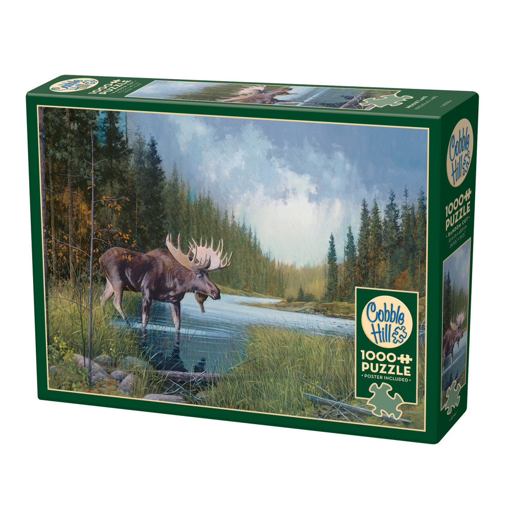 Cobble Hill Moose Lake 1000-piece jigsaw puzzle box featuring a moose wading in a forest stream with evergreen trees and cloudy sky