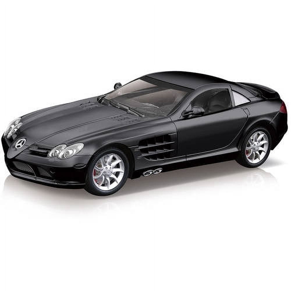 Black Mercedes-Benz SLR McLaren die-cast model car on white background, shown from side angle with chrome wheels