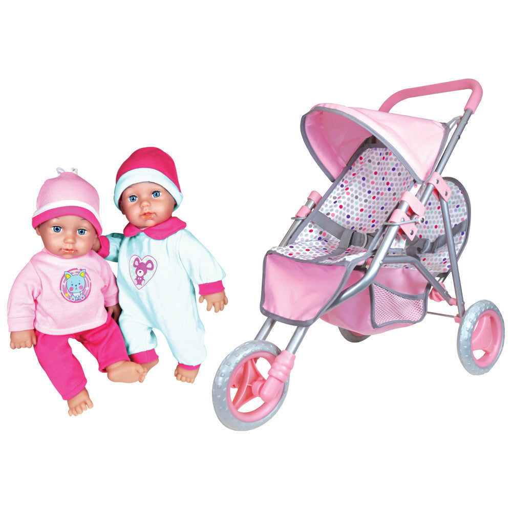 Two baby dolls with hats and outfits next to a pink and gray jogger stroller with polka-dot interior and pink wheels