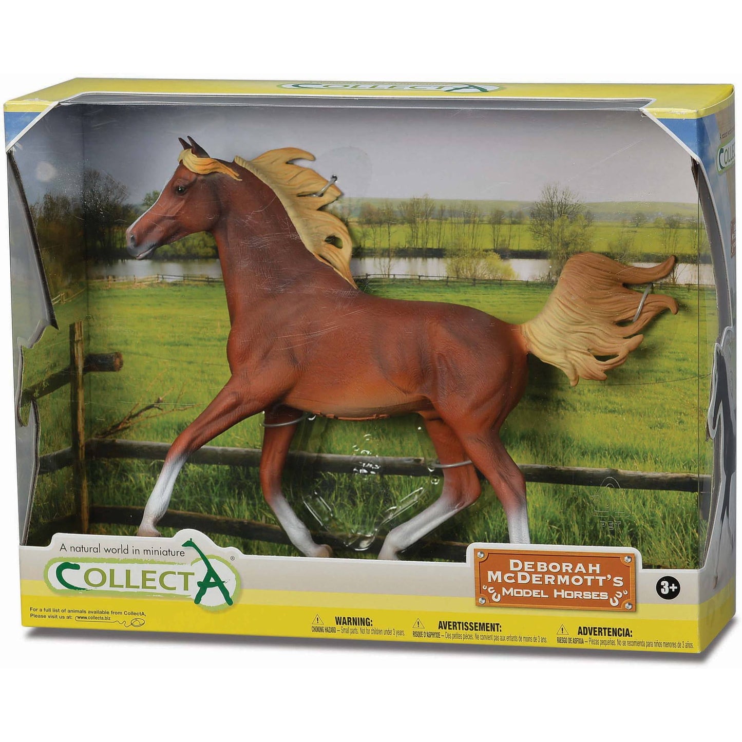 Chestnut Arabian stallion model with golden mane and tail, white markings on legs, displayed in boxed packaging with pastoral ranch backdrop