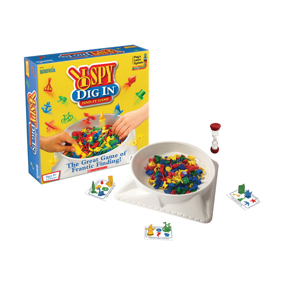 I Spy Dig In find-it game with box, white bowl filled with colorful plastic pieces, sand timer, and game cards