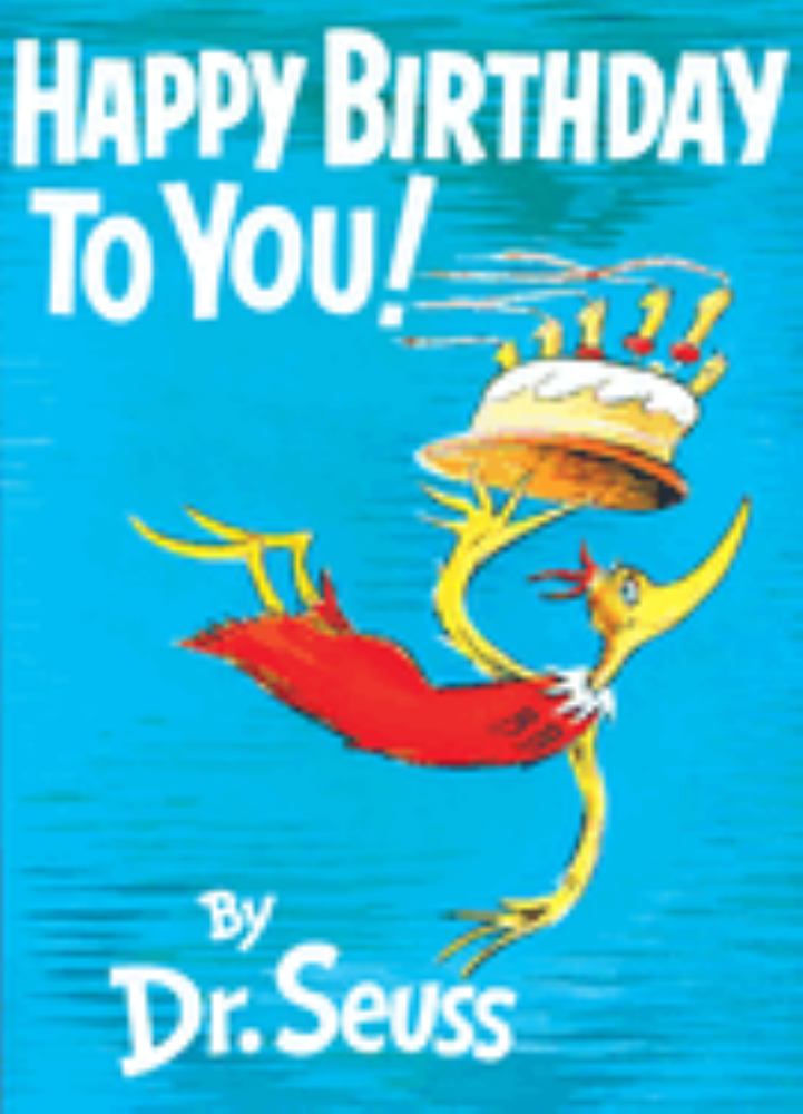 Happy Birthday To You! By Dr. Seuss book cover featuring a yellow creature wearing a tall birthday cake hat with candles, against a bright blue background