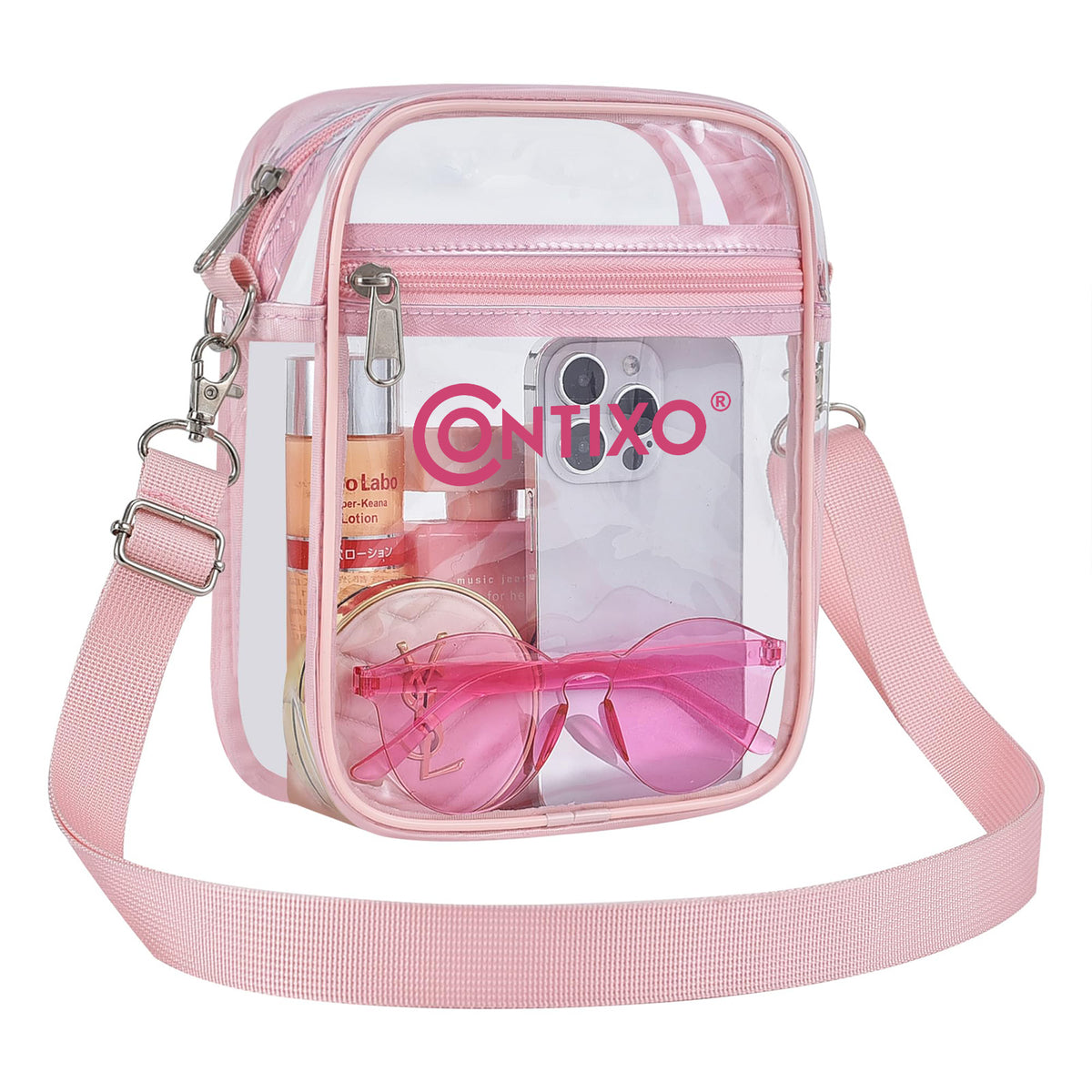 Pink clear crossbody bag with adjustable strap, filled with sunglasses and personal items, featuring Contixo branding