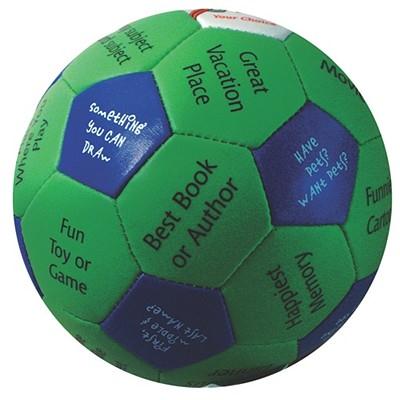 Green and navy fabric ball with hexagonal panels labeled with conversation starter prompts like 'Best Book or Author' and 'Fun Toy or Game'