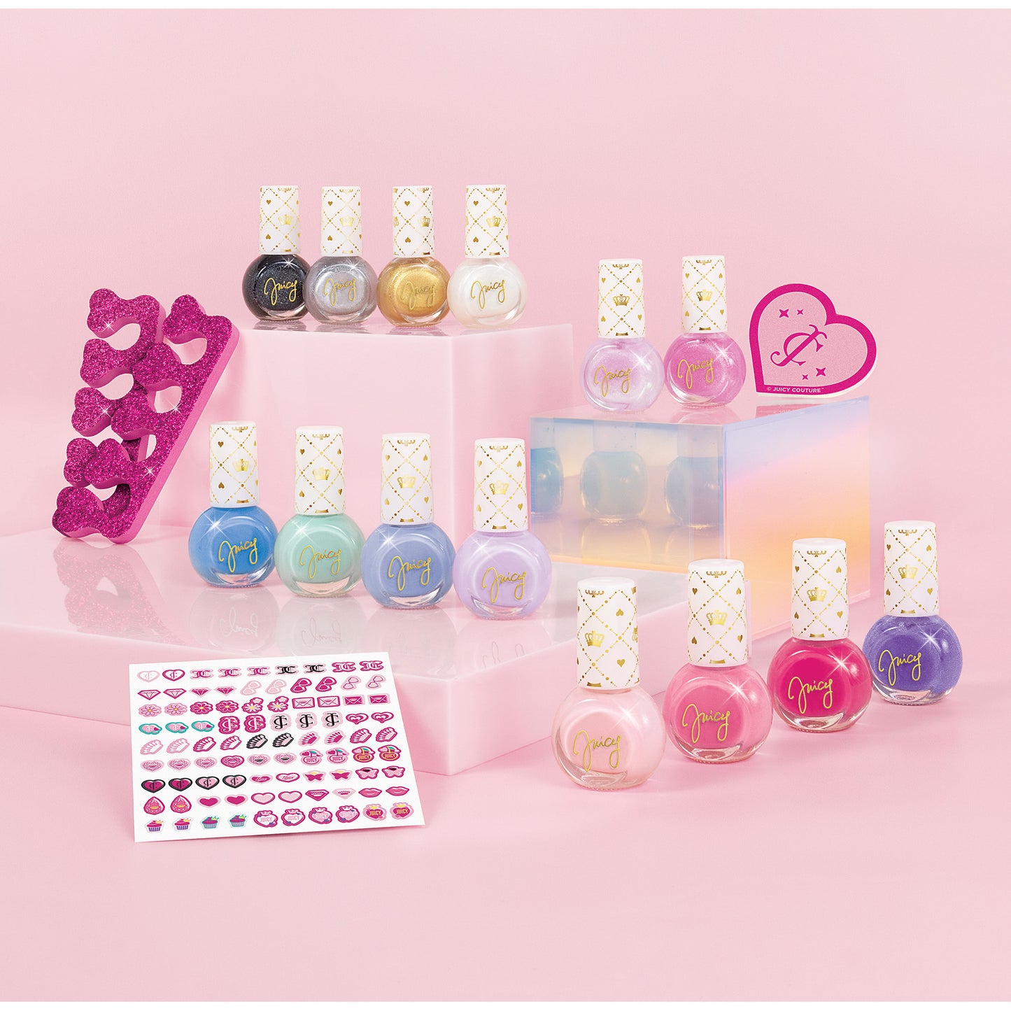 Juicy Couture Nail Polish Chic Design set with colorful bottles, heart toe separators, and nail stickers