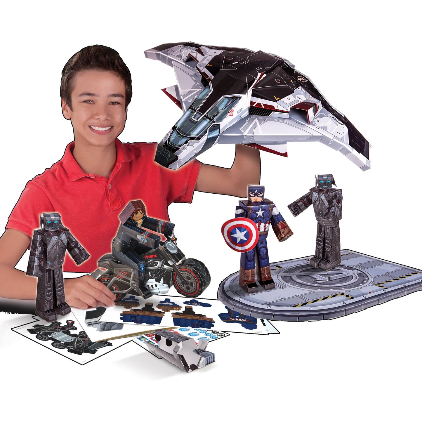 Child modeled by a boy in red shirt holding Marvel Age of Ultron Quinjet vehicle with transforming action figures and playset base displayed