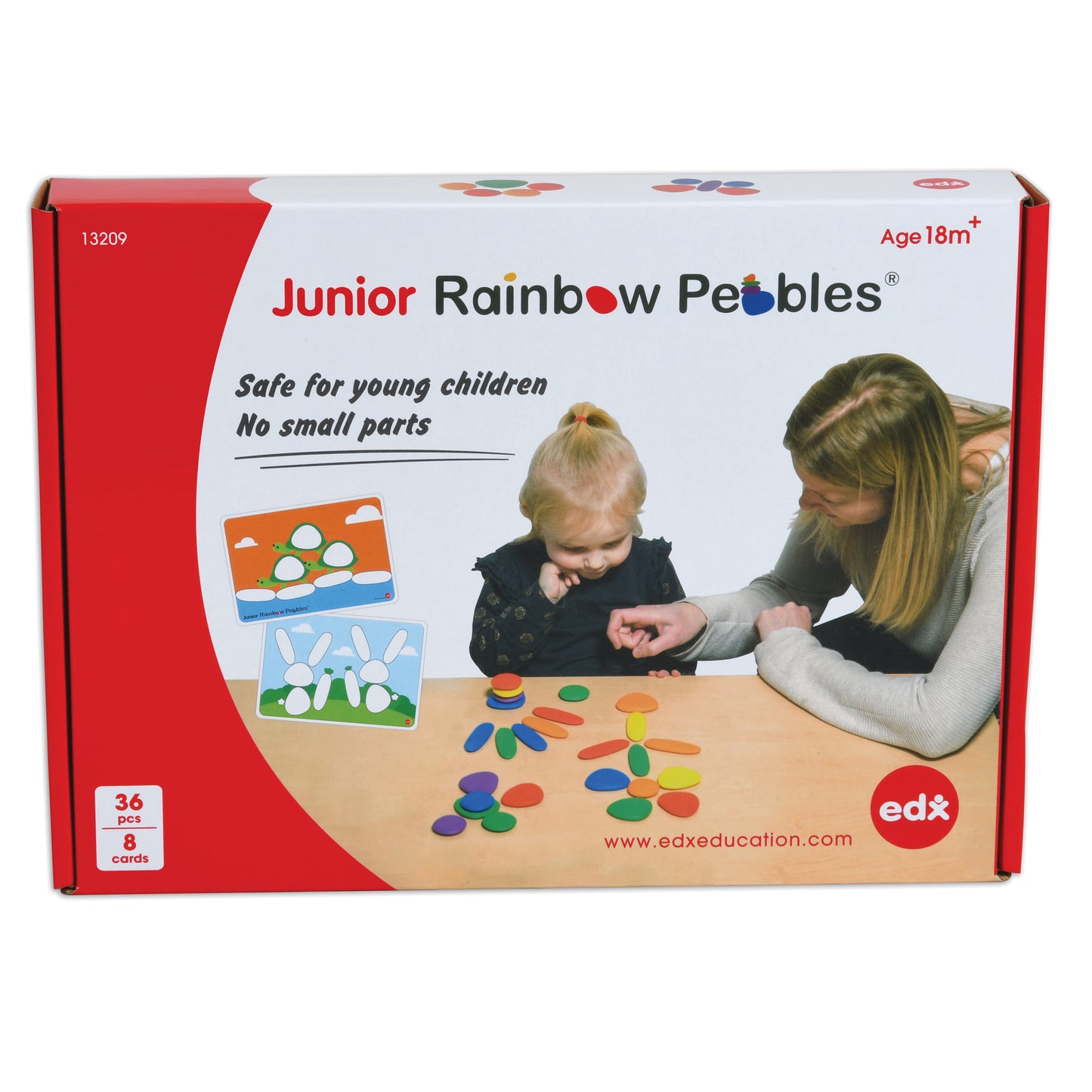 Junior Rainbow Pebbles set box showing colorful plastic pebbles and activity cards, modeled by a child and adult at a wooden table