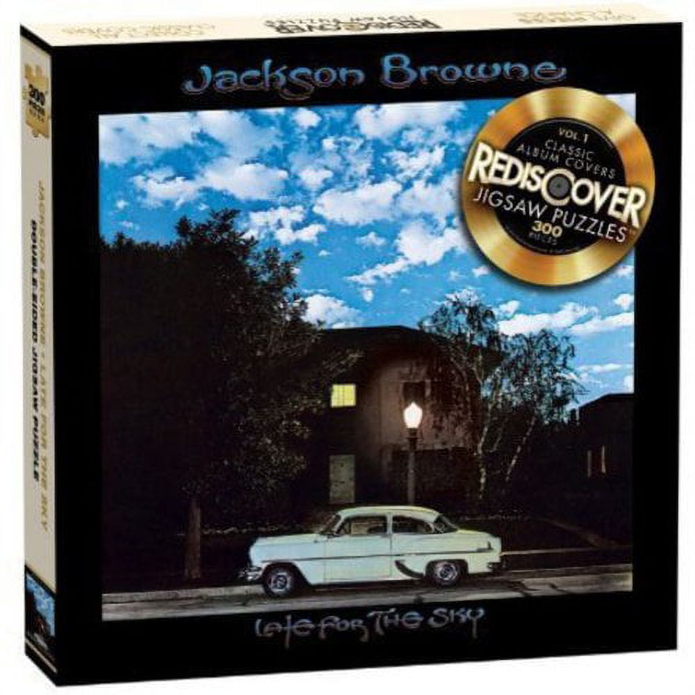 Jackson Browne Rediscover jigsaw puzzle box featuring vintage car parked at night outside a lit house with blue sky and clouds