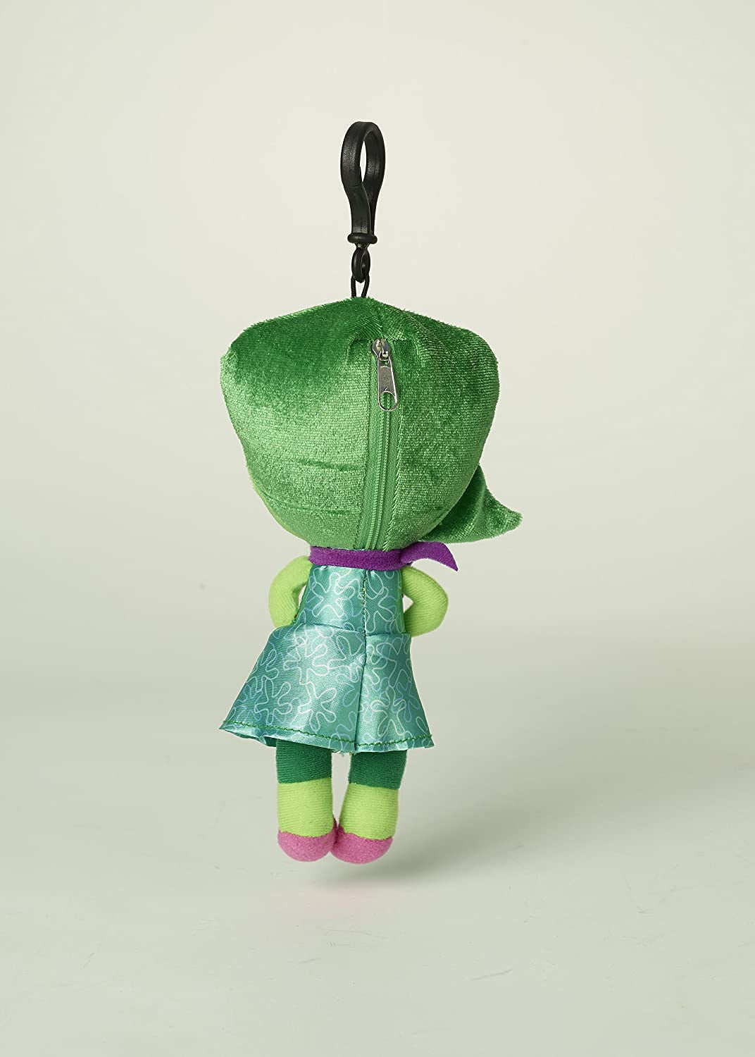 Disgust plush toy from Disney Pixar Inside Out with green head, lime-green arms and legs, teal patterned dress, purple waist ribbon, and black loop attachment