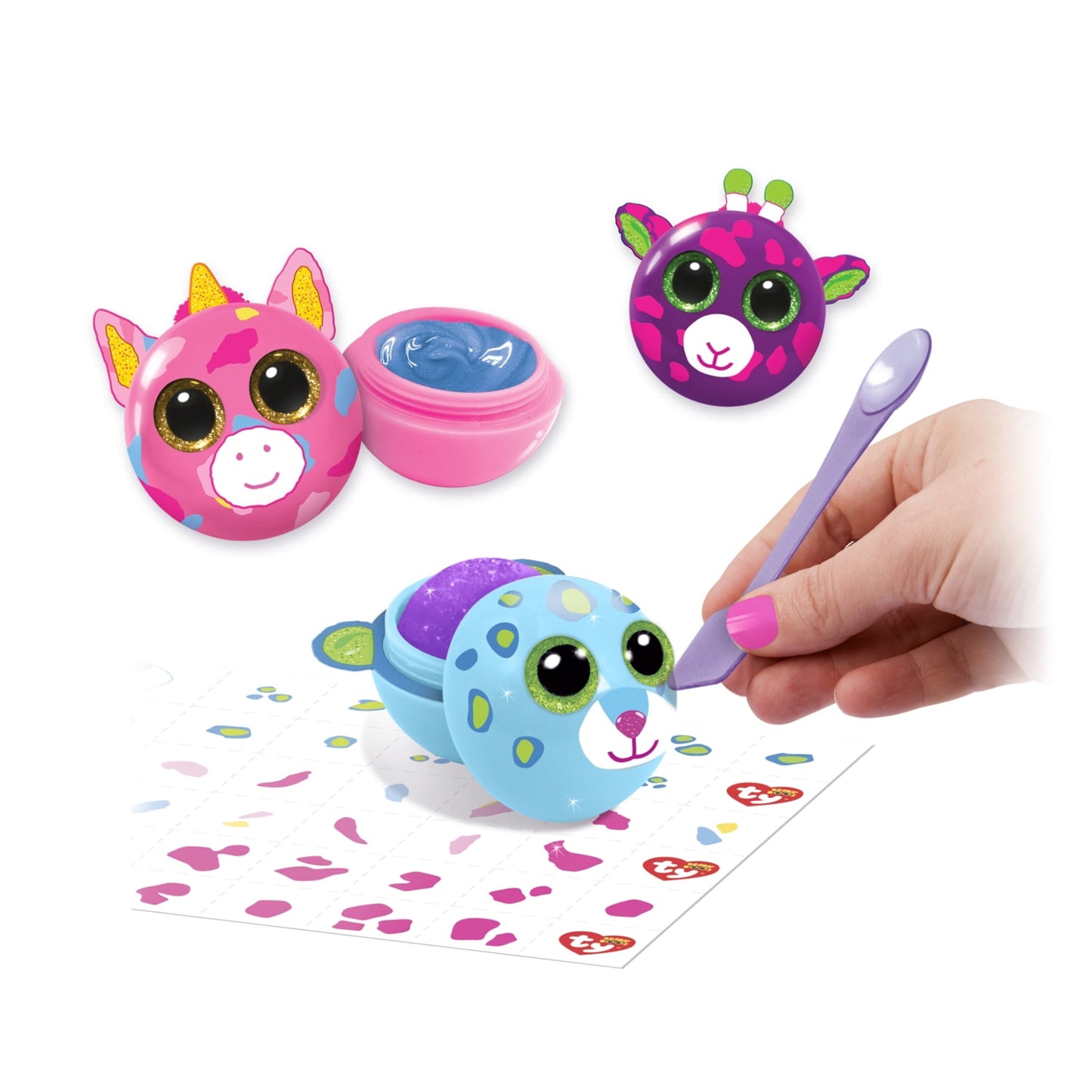 Ty Beanie Boos DIY Lip Gloss Creation Kit with colorful plush character heads, container, brush applicator, and decorative activity sheet, modeled by a child
