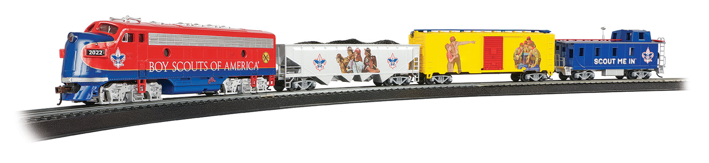 Boy Scouts of America HO scale model train set with red and blue locomotive, white passenger car, yellow and red passenger car, and blue caboose on black track