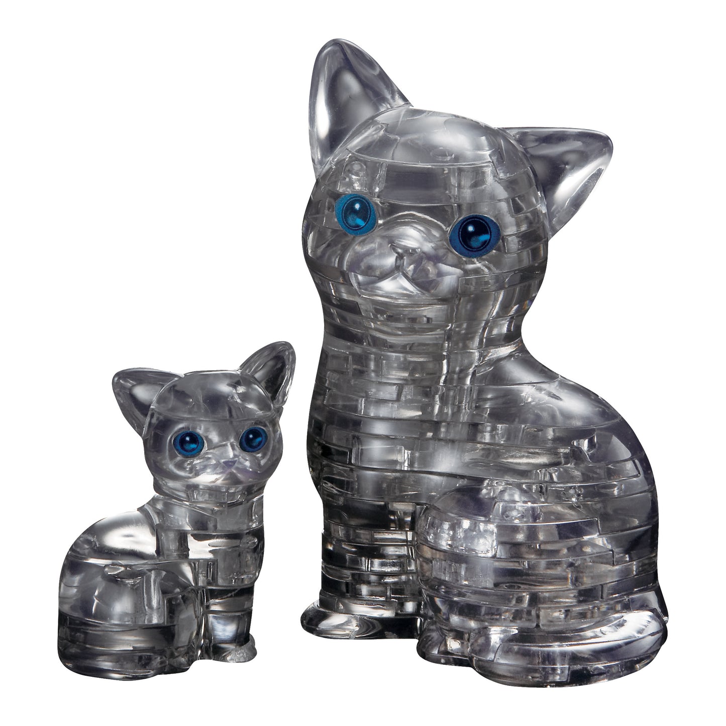 Two transparent black crystal puzzle cat figurines with blue eyes, smaller kitten and larger adult cat side by side