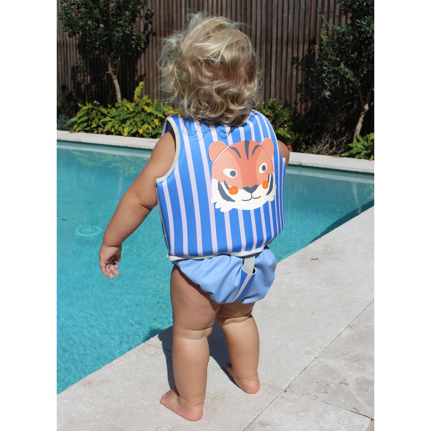 Sunnylife Tino Tiger Float Vest blue striped with tiger face design poolside
