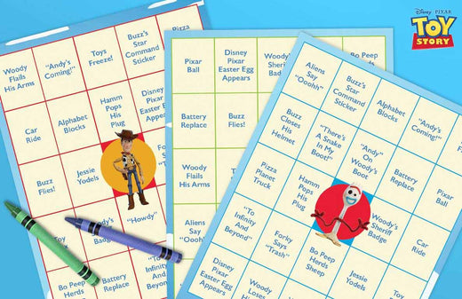 Toy Story movie night bingo cards with Woody and Forky character cutouts and colored markers on blue background
