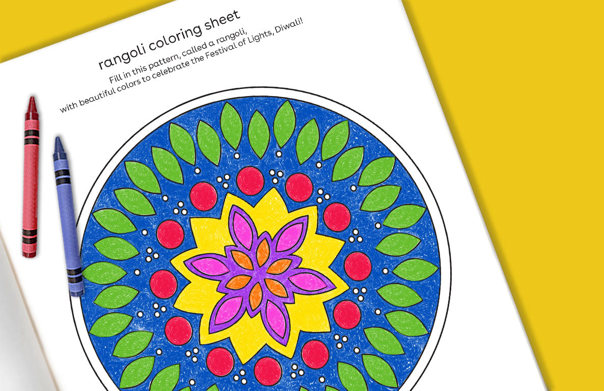 Rangoli coloring sheet with blue, green, red, yellow, and pink geometric floral pattern, accompanied by red and blue crayons on yellow background