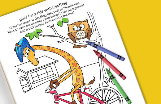 Coloring activity page featuring Geoffrey the giraffe on a bicycle with an owl in a tree, colorful markers displayed on the right side