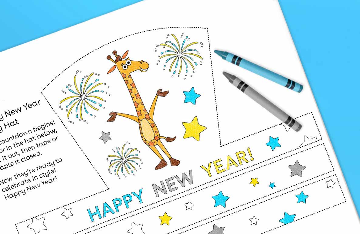 Printable New Year Party Hat craft activity featuring a giraffe with fireworks, stars, and 'Happy New Year' text, shown with crayons on a blue background