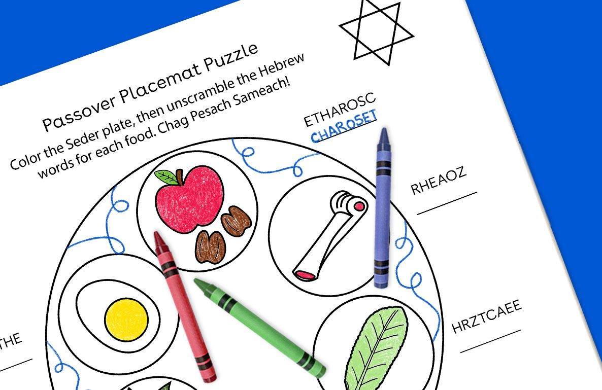 Passover Placemat Puzzle with circular sections containing illustrated apple, nuts, crayon, and leaf, Hebrew words to unscramble around edges, blue crayon and s
