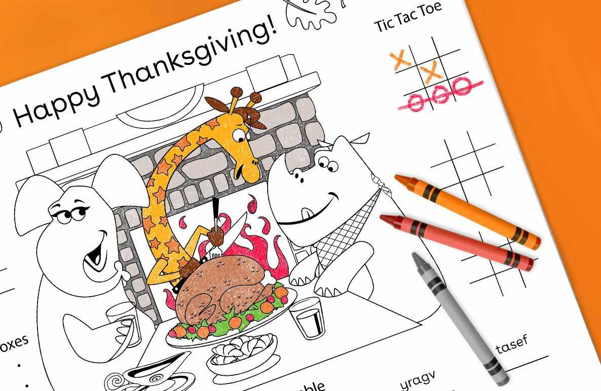 Happy Thanksgiving placemat with cartoon animals at a feast, coloring games including tic-tac-toe, and crayons on orange background