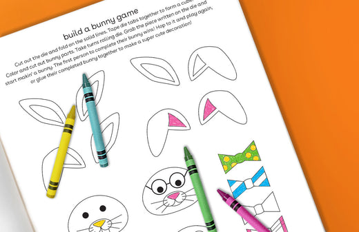 Printable activity page showing a build-a-bunny game with blank bunny face templates, colorful crayons, and example bunny designs with different ear patterns an