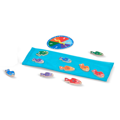Catch & Count Magnetic Wooden Fishing Game with colorful fish pieces, blue board, and numbered spinner wheel