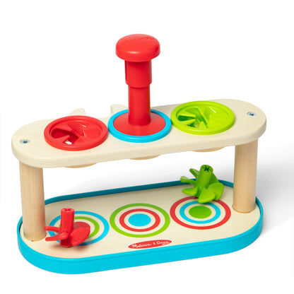 Melissa & Doug Match & Push Spinning Tops wooden toy with red, green, and blue spinning tops on natural wood base