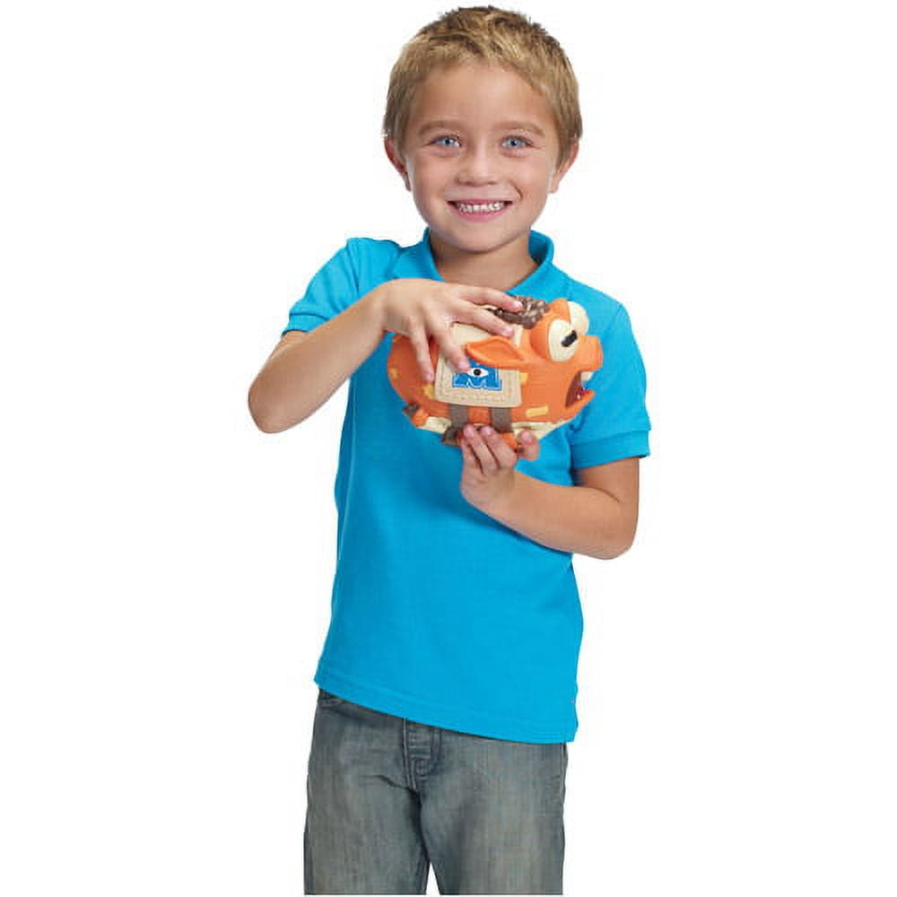 Child modeled by a boy in blue shirt holding orange Archie plush from Monsters Inc. Monsters University