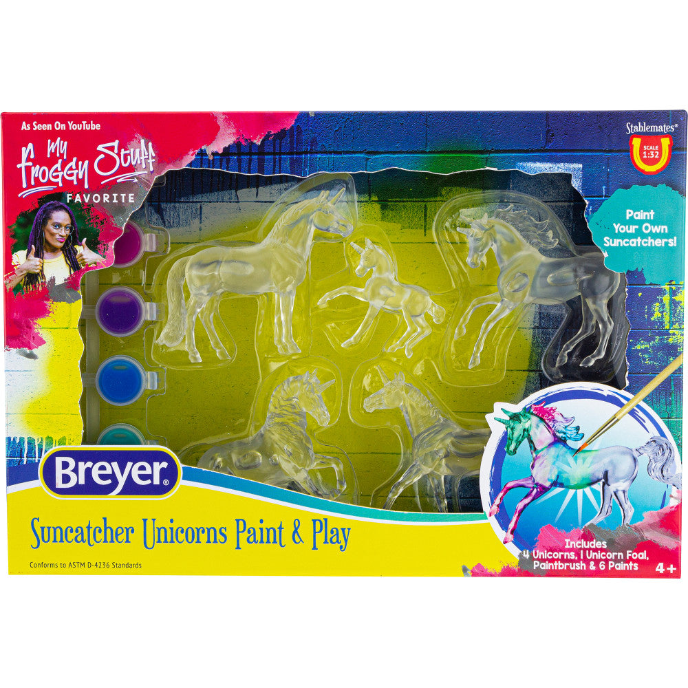 Breyer Suncatcher Unicorns Paint & Play set showing four clear unicorn molds, paint pots in purple and blue, paintbrush, and completed suncatcher example on pac