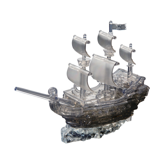 Black pirate ship 3D crystal puzzle with translucent plastic pieces, featuring three sails, a flag with skull and crossbones, cannon, and detailed hull on white