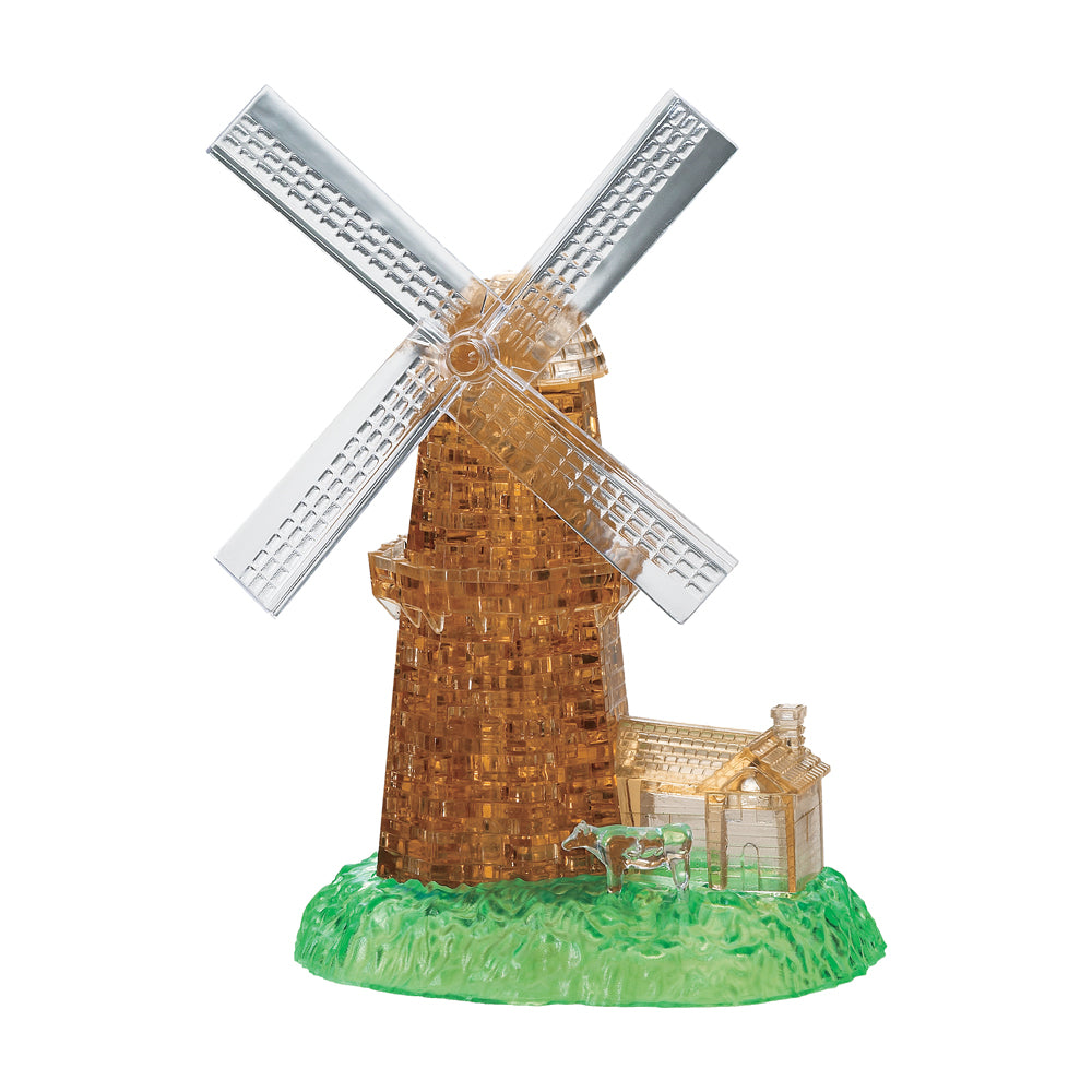 BePuzzled Windmill 3D Crystal Puzzle assembled model showing transparent amber windmill tower with rotating blades, cream cottage, and green grass base