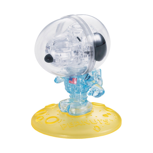 BePuzzled Peanuts Astronaut Snoopy 3D Crystal Puzzle assembled figure showing transparent astronaut with large helmet, black ears, blue spacesuit with American