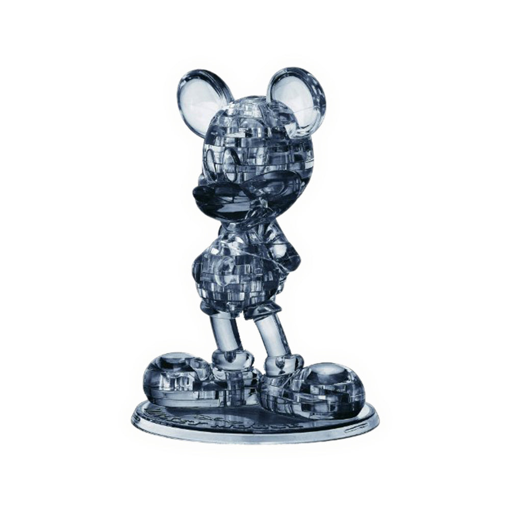 BePuzzled Disney Mickey Mouse 3D Crystal Puzzle assembled figure, translucent dark blue plastic with geometric pattern design, standing pose on oval base