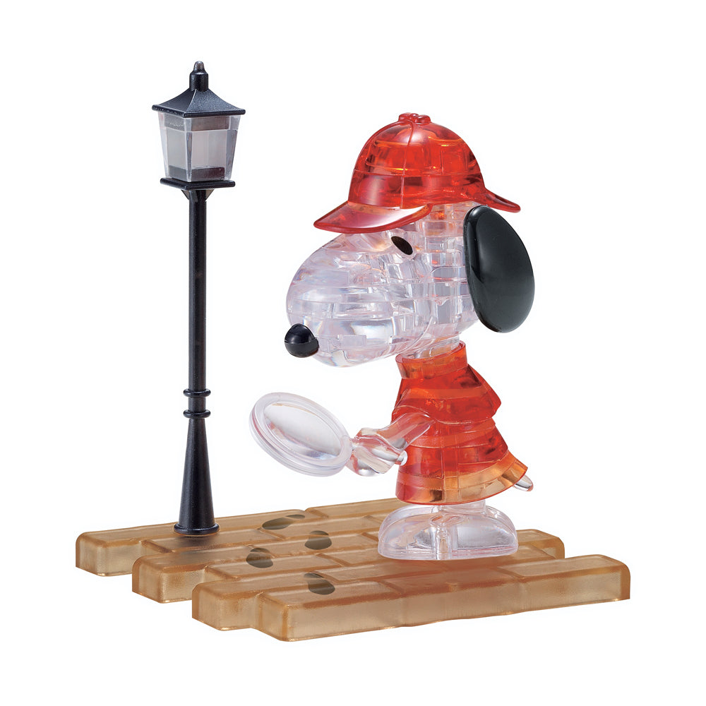BePuzzled Peanuts Detective Snoopy 3D Crystal Puzzle assembled figure wearing red detective outfit and hat, holding magnifying glass, displayed on wooden base w