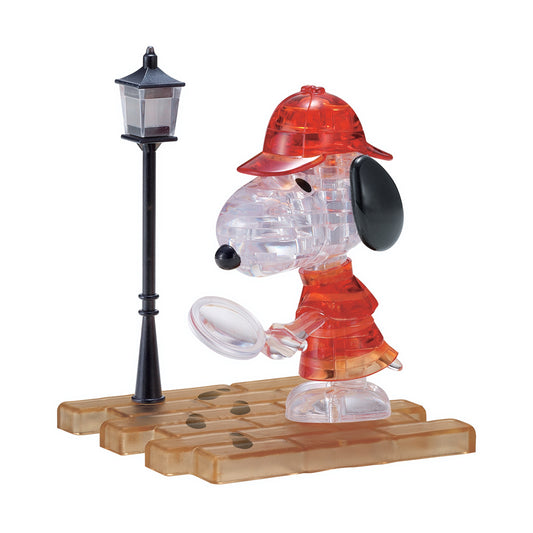 BePuzzled Peanuts Detective Snoopy 3D Crystal Puzzle assembled figure wearing red detective outfit and hat, holding magnifying glass, displayed on wooden base w