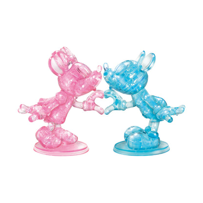 Pink and blue translucent 3D crystal puzzle figurines of Minnie and Mickey Mouse making a heart shape with their hands