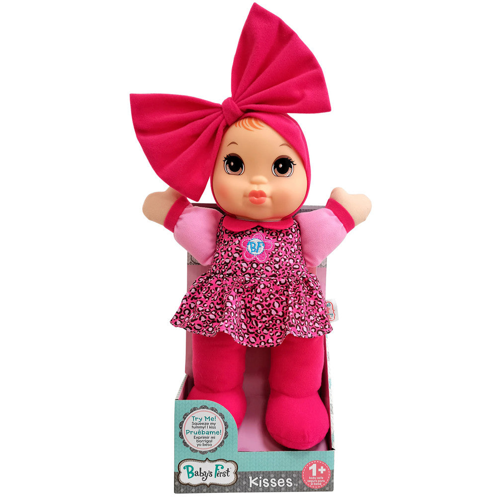 Baby's First Kisses doll with large hot pink bow headwear, pink leopard-print dress, pink puffy sleeves, and matching pink legs, on plain background