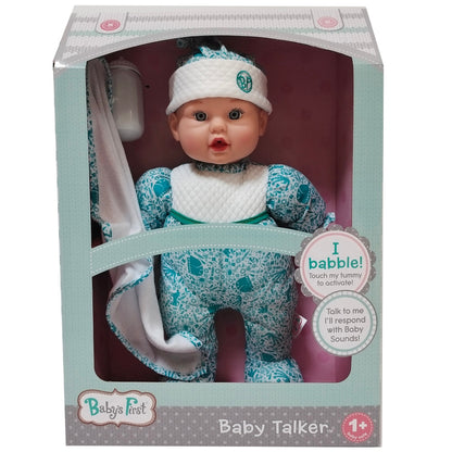 Baby's First Baby Talker interactive doll in packaging, wearing white headband and teal patterned outfit with white bib, includes bottle and blanket accessories