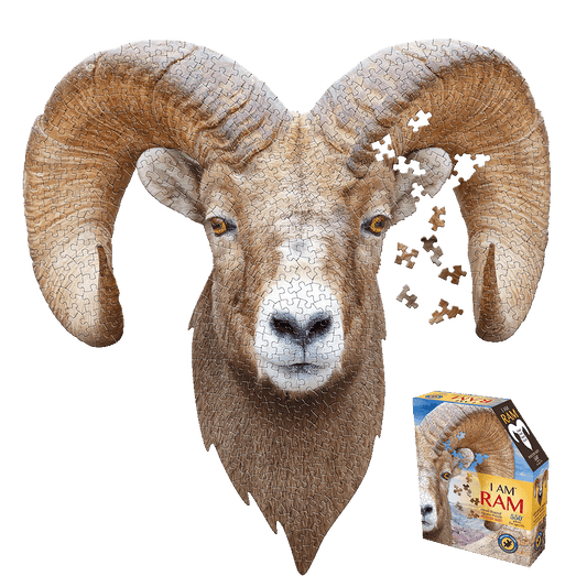 Ram head-shaped jigsaw puzzle with brown and white pieces, some loose pieces scattered to the right, shown with product box below