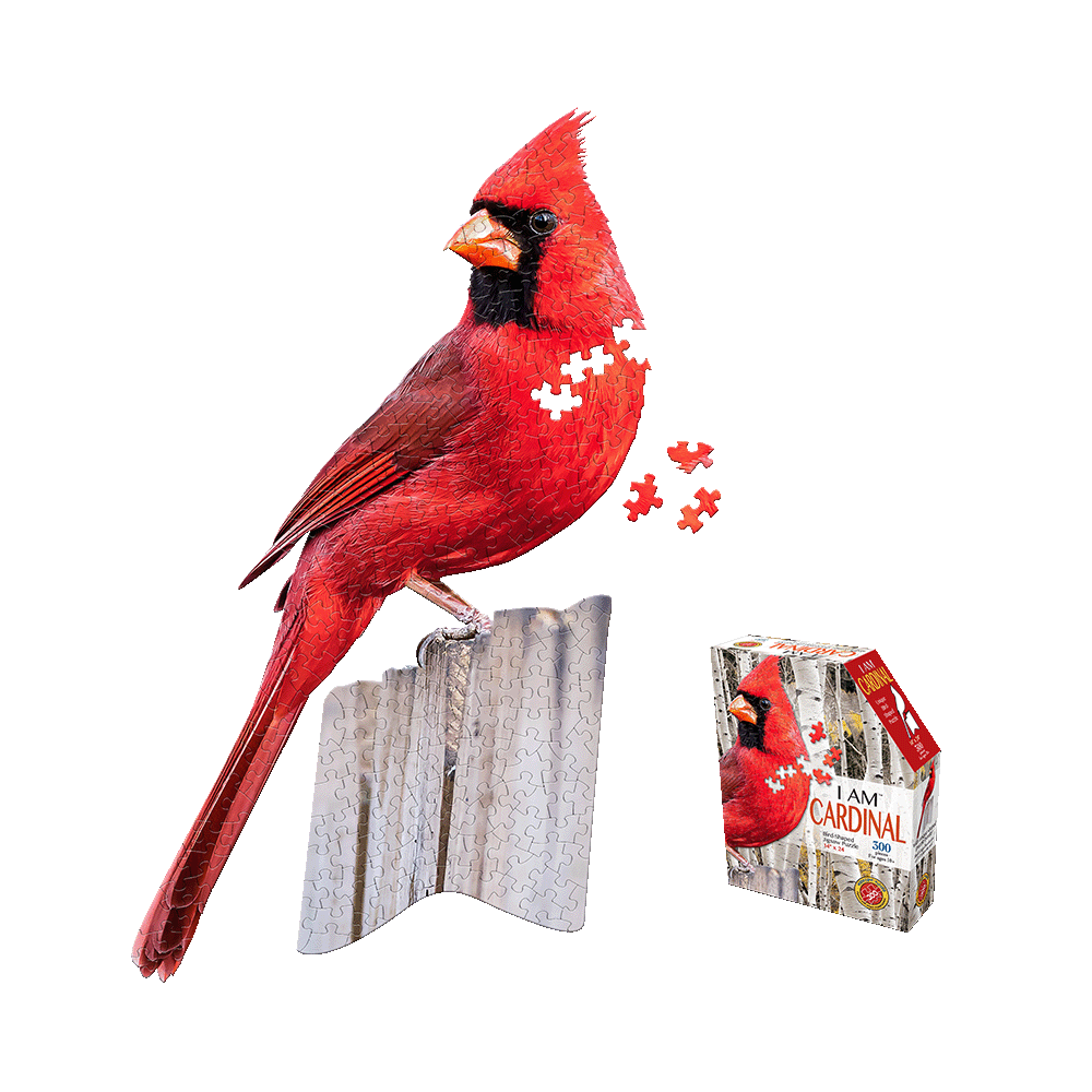Red cardinal-shaped jigsaw puzzle displayed assembled on stand with loose puzzle pieces and product box showing completed cardinal image