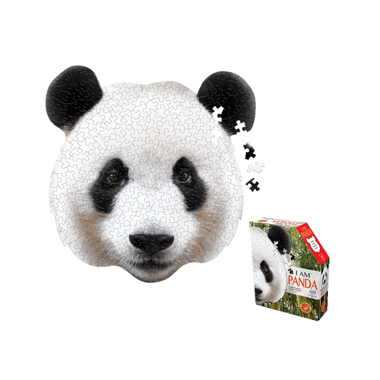 Madd Capp I AM Panda 300-piece jigsaw puzzle shaped like a panda head with black ears, white face, and black eye patches, shown assembled with loose pieces besi