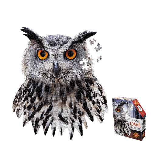 Gray owl with orange eyes and black feather markings, partially assembled into puzzle pieces, next to I AM OWL 300-piece puzzle box