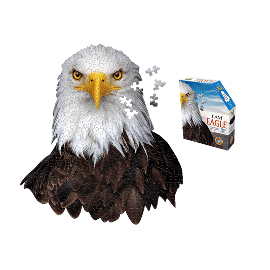 I AM EAGLE 300-piece jigsaw puzzle shaped like an eagle head with white and gray plumage, yellow eyes and beak, dark brown feathers, shown assembled next to its